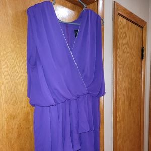 Purple Jumpsuit with draped overlay